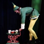 buddy pushes cocoa cart in elf jr at greasepaint youth theatre in scottsdale